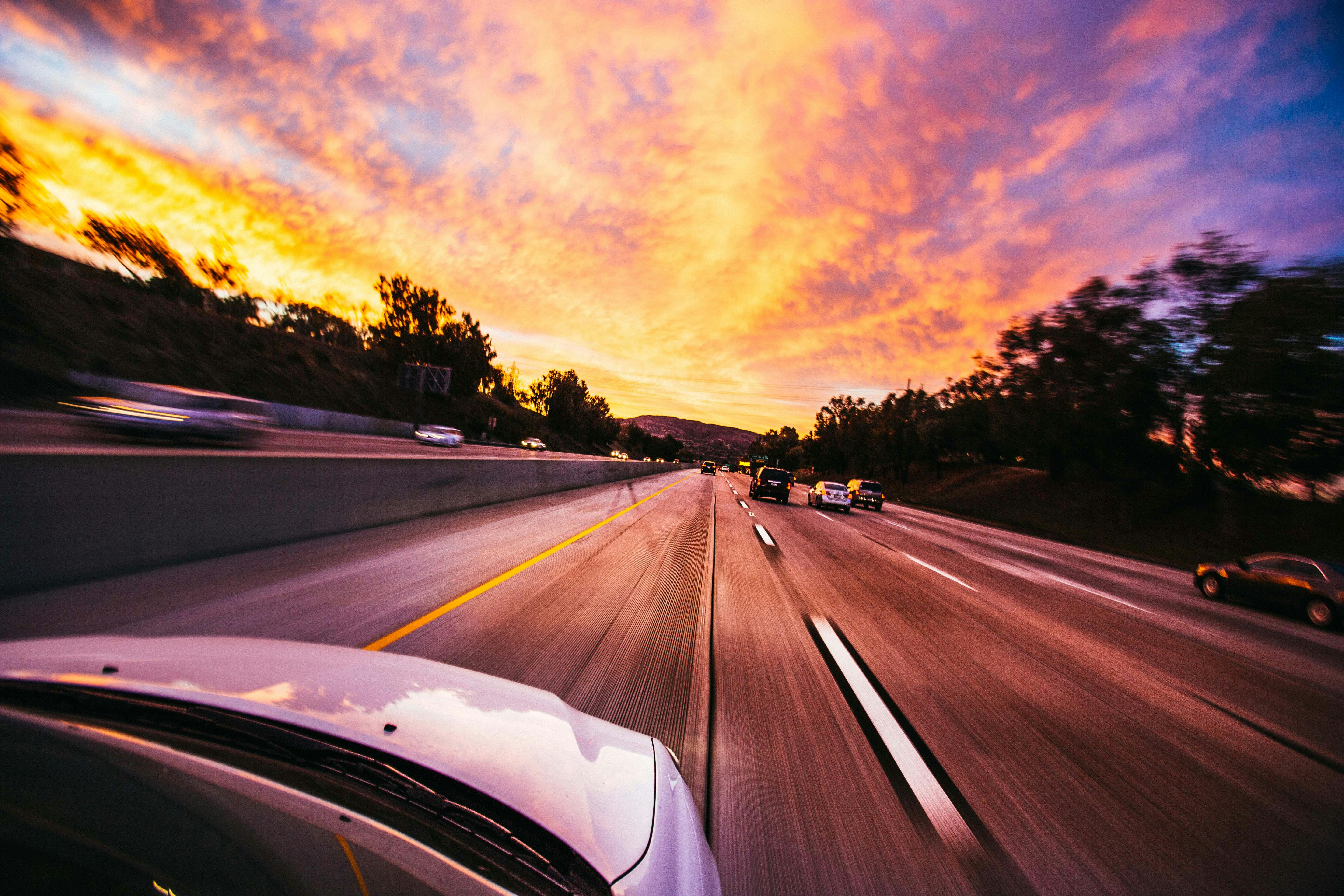 Accelerating Ahead with AI Companion. A car driving on a highway.