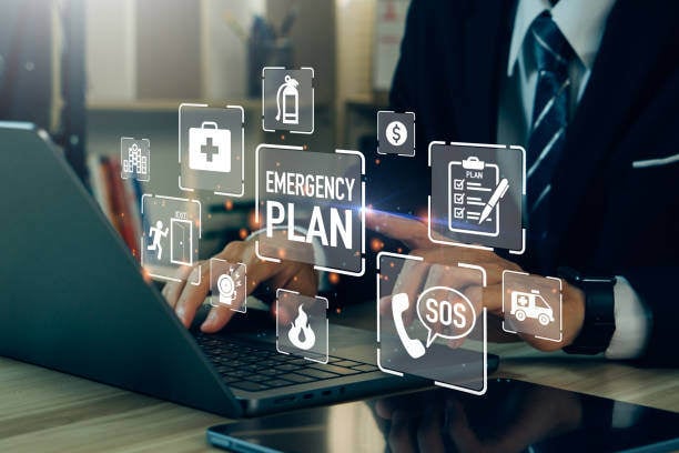 Emergency Continuity Solutions. Professional man engaged with laptop, featuring icons that symbolize various emergency planning concepts.