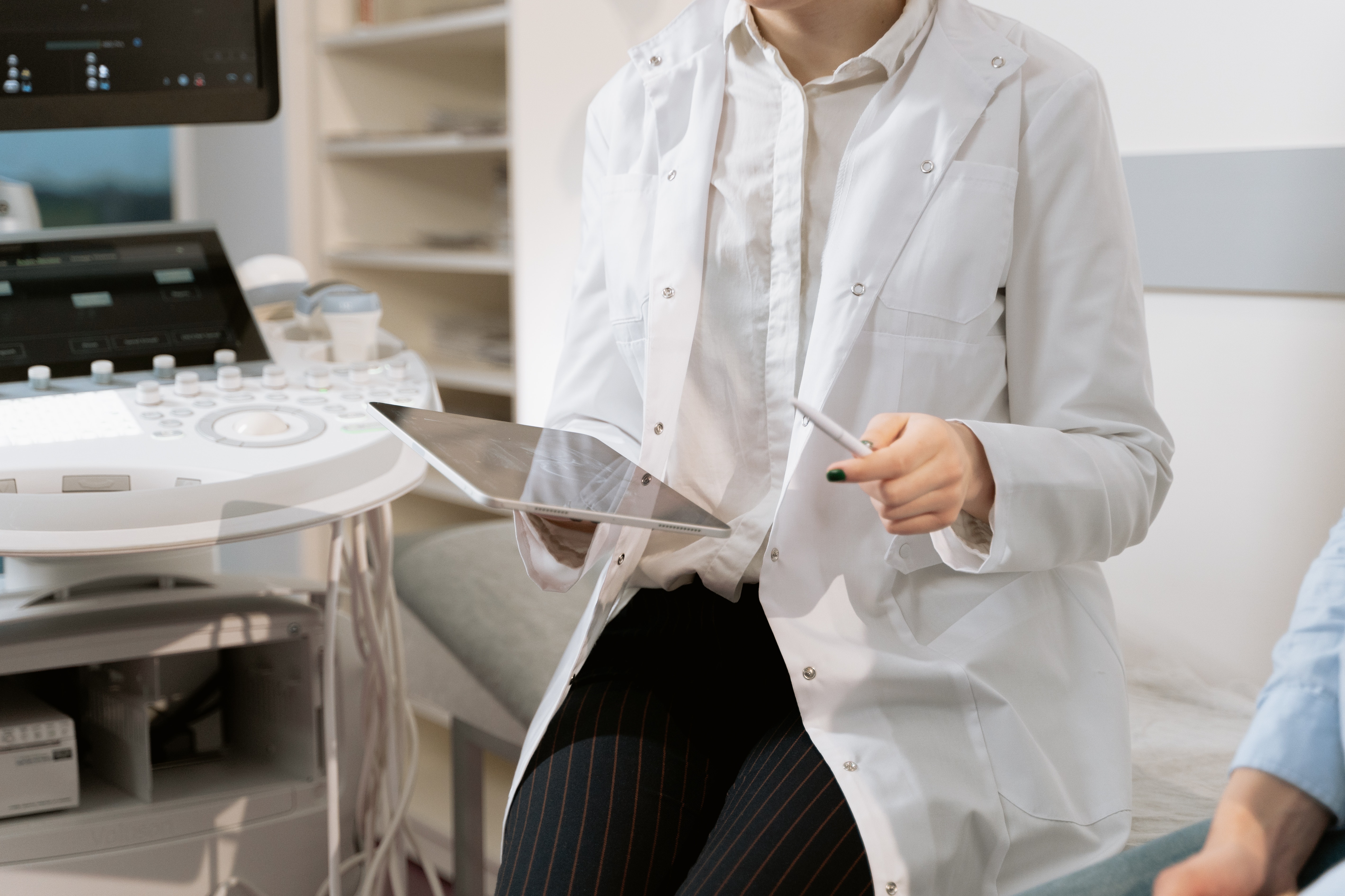 Zoom for Healthcare. Doctor with an ipad.