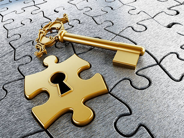 Shiny gold key placed on a puzzle piece, representing solutions and unlocking potential.