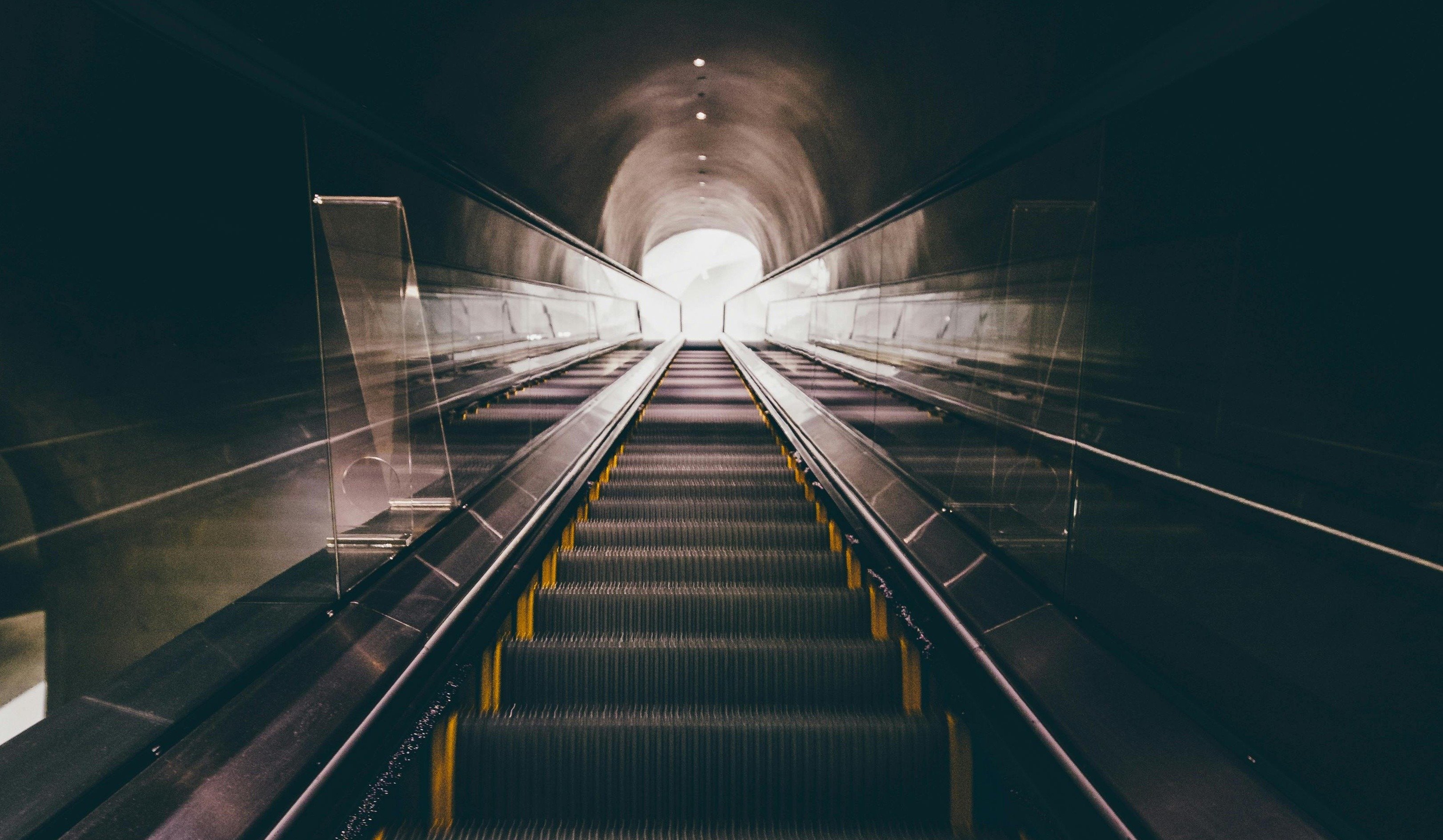 An escalator ascending into a tunnel, providing convenient access to the underground passage.